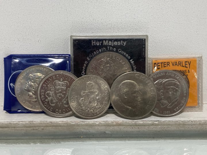 Lot 558  
            Marchington SR13 - Parcel Delivery Only 

                
A COLLECTION OF COMMEMORATIVE VINTAGE COINS AND CROWNS: LOCATION - H1