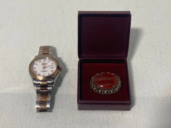 Lot 892  
            Marchington SR13 - Parcel Delivery Only 

                
A VINTAGE SILVER COLOURED STONE-SET BROOCH, WITH BOX TO ALSO INCLUDE A GENTS ROTA...