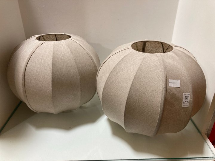 Lot 1203  
            Marchington SR10 - Parcel Delivery Only 

                
2 X NKUKU ORISA LINEN LAMPSHADES IN OFF WHITE COMBINED ORIGINAL RRP: £270: LOCATI...