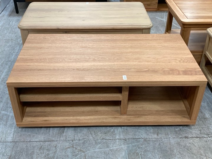Lot 114  
            Marchington SR10 - Delivery or Collection 

                
OAK FURNITURELAND HIGHWORTH STORAGE COFFEE TABLE IN NATURAL SOLID OAK FINISH - OR...
