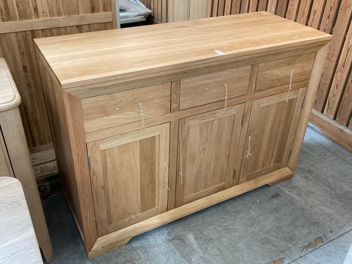 Lot 122  
            Marchington SR10 - Delivery or Collection 

                
OAK FURNITURELAND BEVEL NATURAL SOLID OAK LARGE SIDEBOARD - ORIGINAL RRP £629.99:...