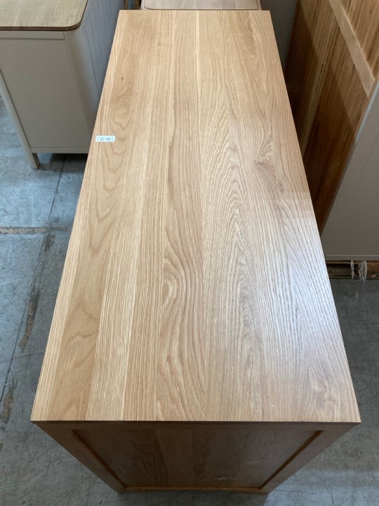 Lot 122  
            Marchington SR10 - Delivery or Collection 

                
OAK FURNITURELAND BEVEL NATURAL SOLID OAK LARGE SIDEBOARD - ORIGINAL RRP £629.99:...