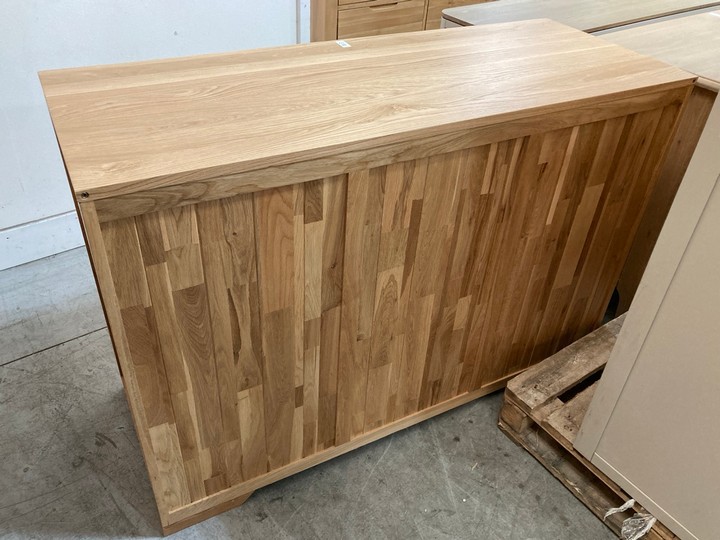 Lot 122  
            Marchington SR10 - Delivery or Collection 

                
OAK FURNITURELAND BEVEL NATURAL SOLID OAK LARGE SIDEBOARD - ORIGINAL RRP £629.99:...