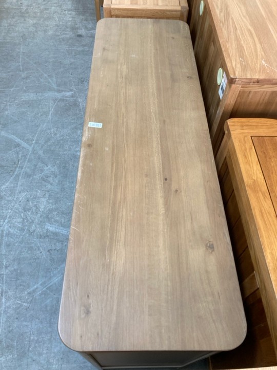 Lot 16  
            Marchington SR10 - Delivery or Collection 

                
OAK FURNITURELAND OTTO SMOKED OAK FINISH AND CASHMERE PAINTED LARGE SIDEBOARD - O...