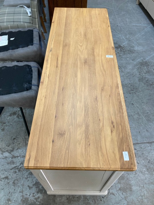 Lot 21  
            Marchington SR10 - Delivery or Collection 

                
OAK FURNITURELAND HENLEY NATURAL OAK AND STONE PAINTED HARDWOOD LARGE SIDEBOARD -...