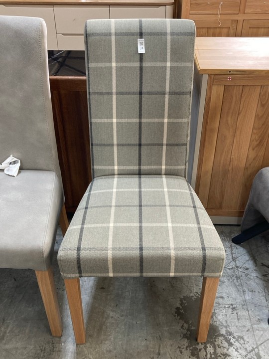 Lot 24  
            Marchington SR10 - Delivery or Collection 

                
OAK FURNITURELAND SCROLL BACK CHAIR IN CHECKED GRANITE FABRIC WITH SOLID OAK LEGS...