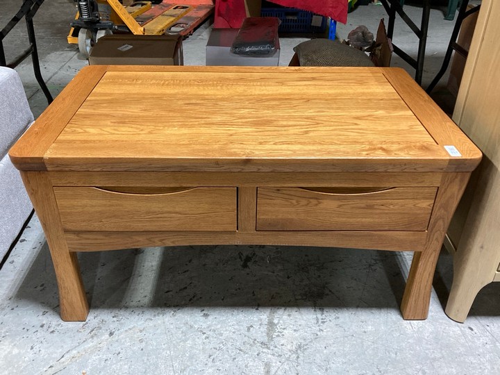 Lot 357  
            Marchington SR10 - Delivery or Collection 

                
OAK FURNITURELAND ORRICK RUSTIC SOLID OAK 4 DRAWER STORAGE COFFEE TABLE - ORIGINA...