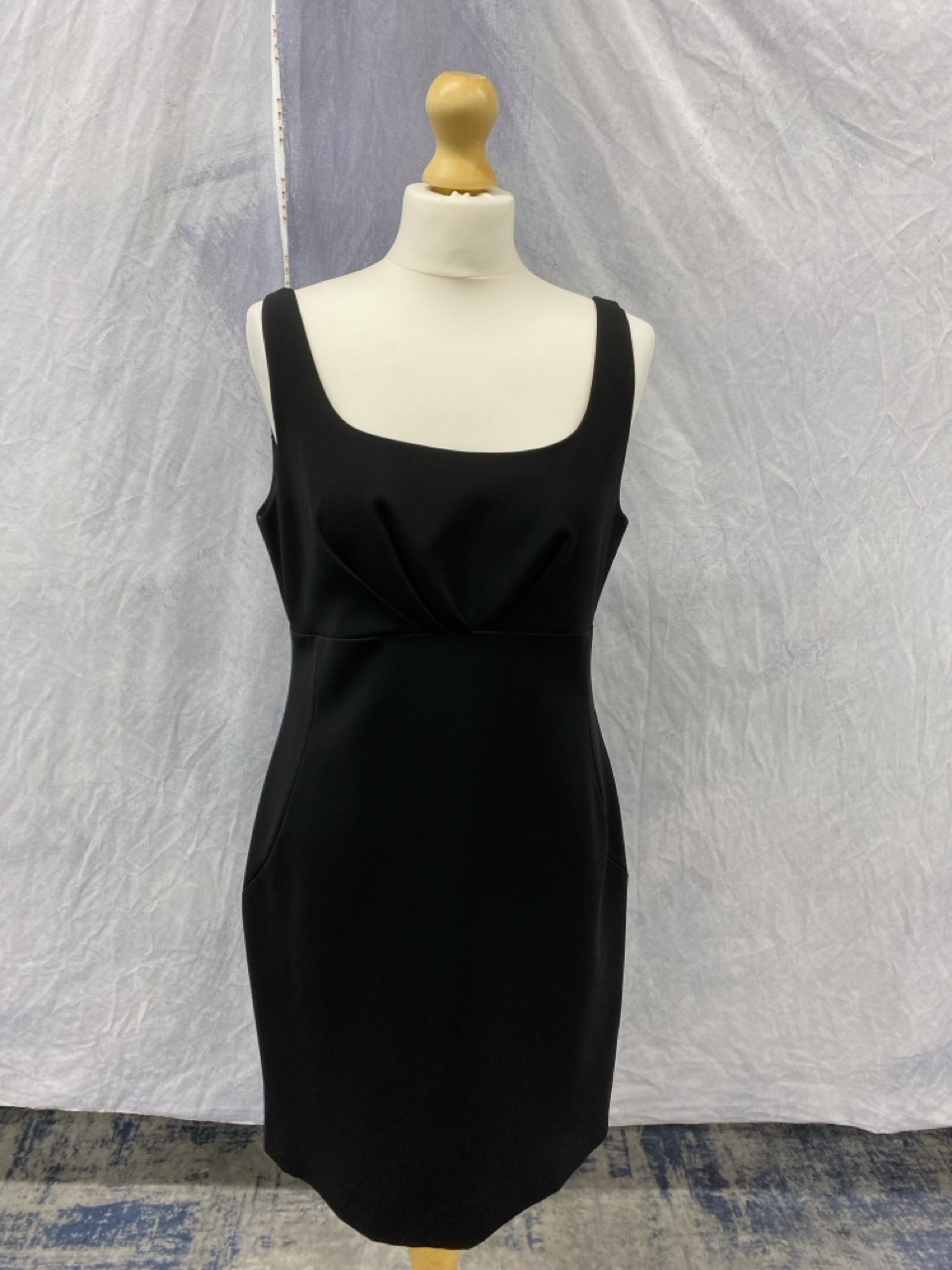 Lot 164  
            Edinburgh SR20 - Delivery Only 

                
MOSCHINO SQUARE NECK MINI DRESS IN BLACK POLYESTER SIZE UK 14: LOCATION - RAIL 2