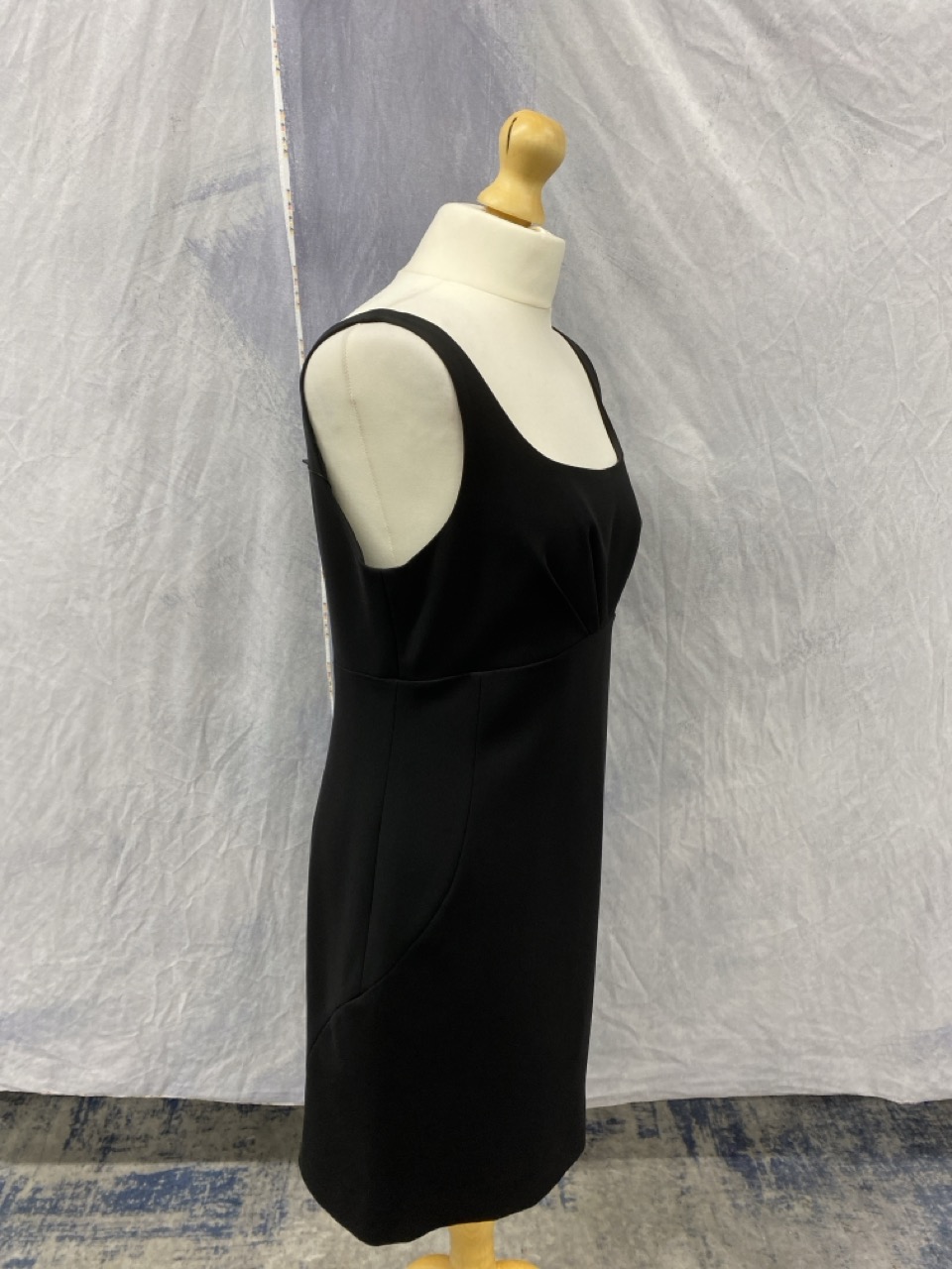 Lot 164  
            Edinburgh SR20 - Delivery Only 

                
MOSCHINO SQUARE NECK MINI DRESS IN BLACK POLYESTER SIZE UK 14: LOCATION - RAIL 2