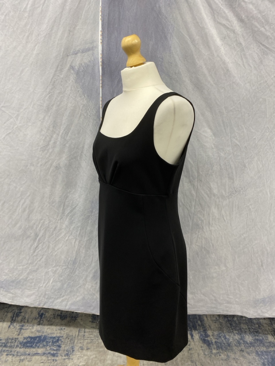 Lot 164  
            Edinburgh SR20 - Delivery Only 

                
MOSCHINO SQUARE NECK MINI DRESS IN BLACK POLYESTER SIZE UK 14: LOCATION - RAIL 2