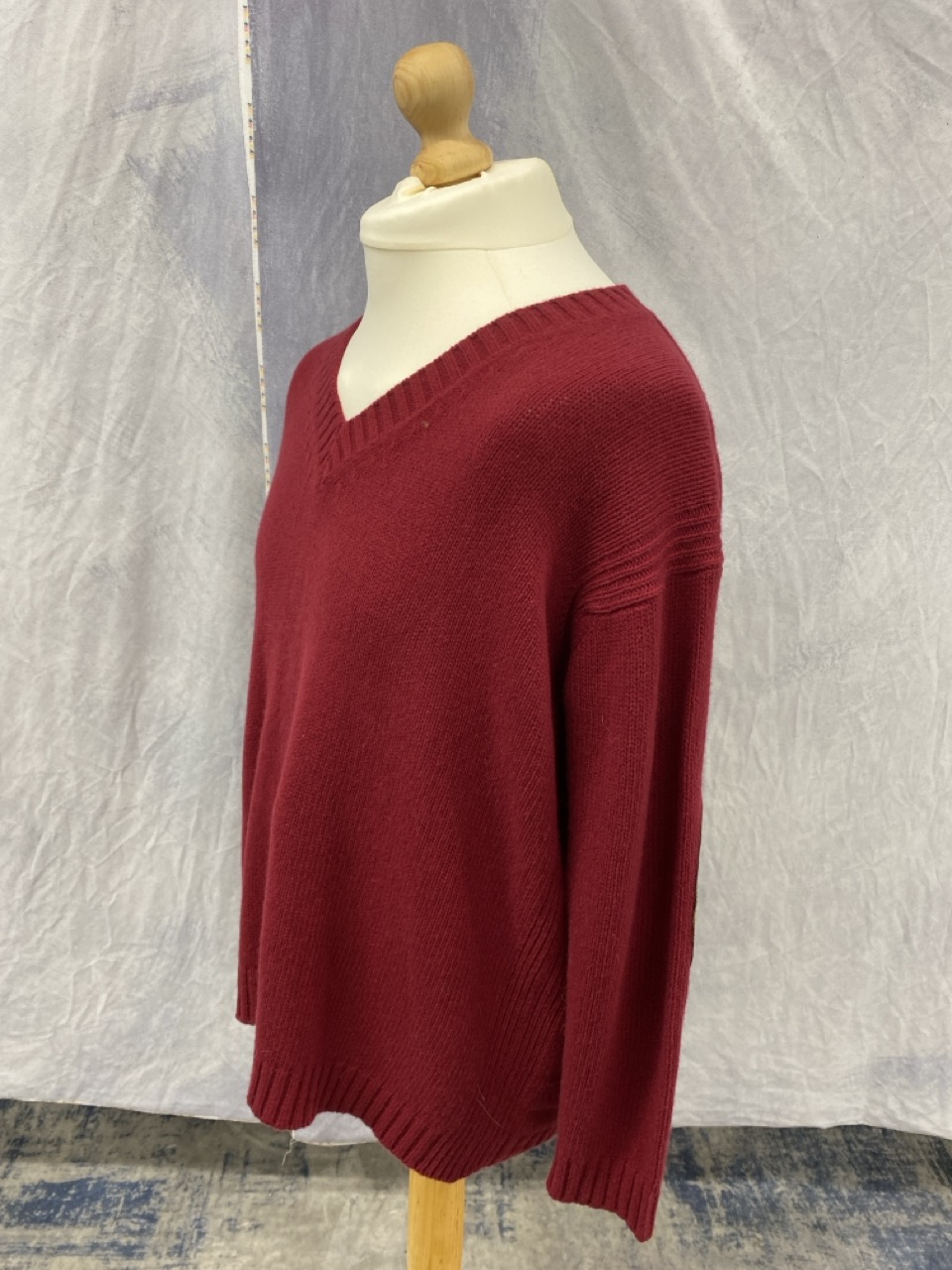 Lot 175  
            Edinburgh SR20 - Delivery Only 

                
PRADA ELBOW PATCH V-NECK SWEATER IN BURGUNDY WOOL SIZE 40: LOCATION - RAIL 2