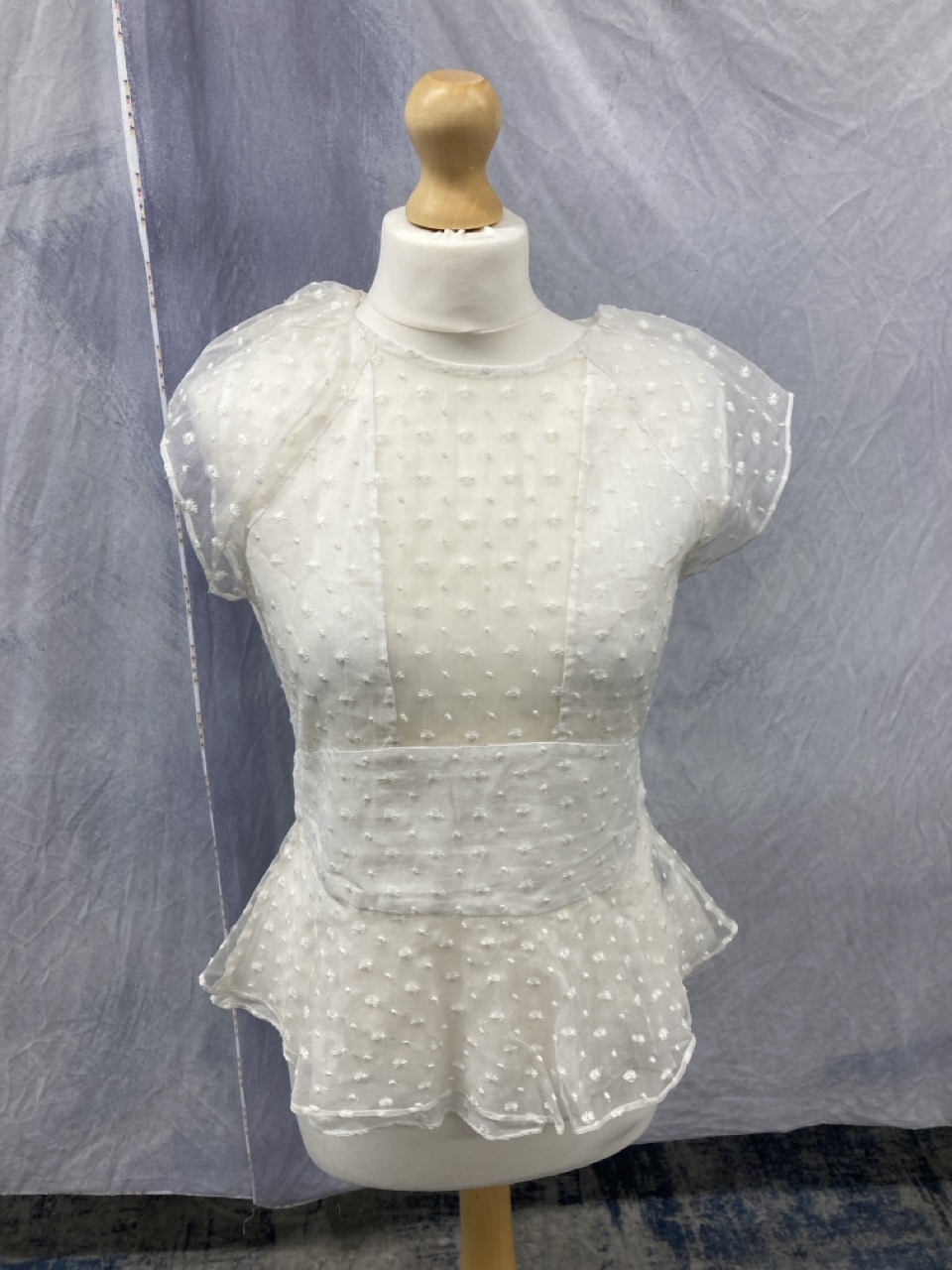 Lot 198  
            Edinburgh SR20 - Delivery Only 

                
ISABEL MARANT SHEER PANEL PEPLUM TOP IN WHITE SILK SIZE 38: LOCATION - RAIL 2