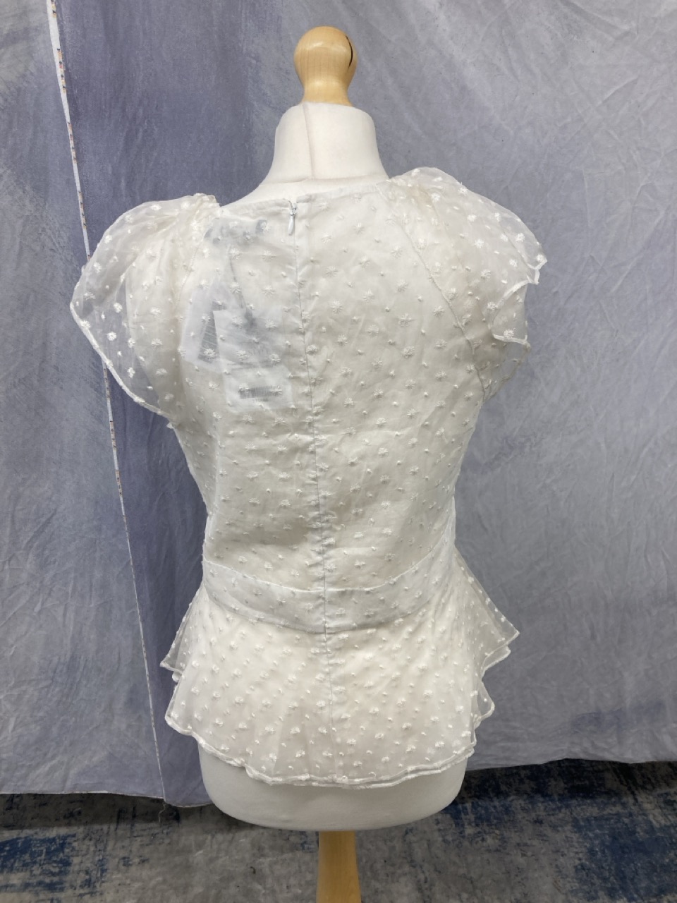 Lot 198  
            Edinburgh SR20 - Delivery Only 

                
ISABEL MARANT SHEER PANEL PEPLUM TOP IN WHITE SILK SIZE 38: LOCATION - RAIL 2