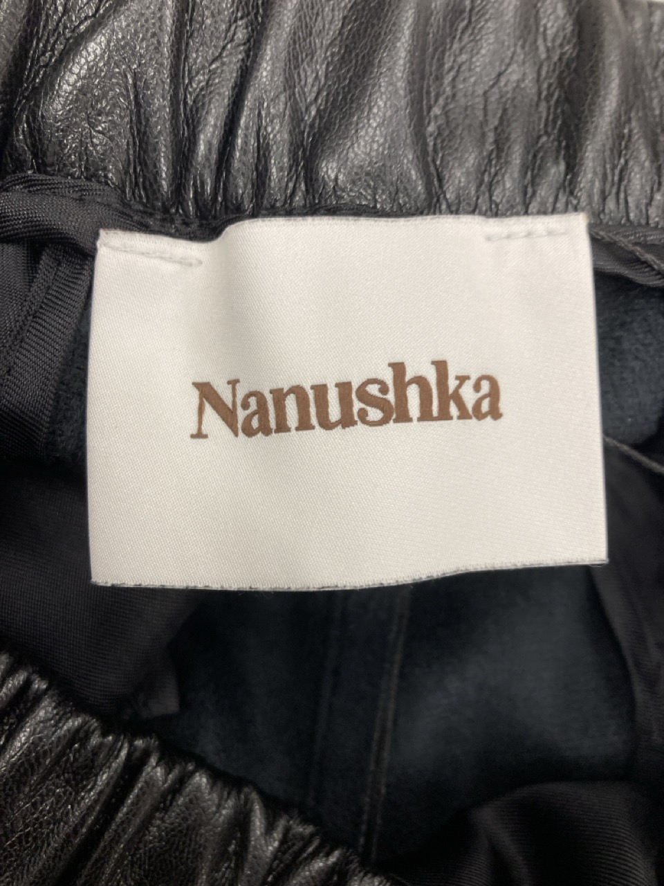 Lot 207  
            Edinburgh SR20 - Delivery Only 

                
NANUSKHA DRAWSTRING PANTS IN BLACK FAUX LEATHER SIZE M: LOCATION - RAIL 2