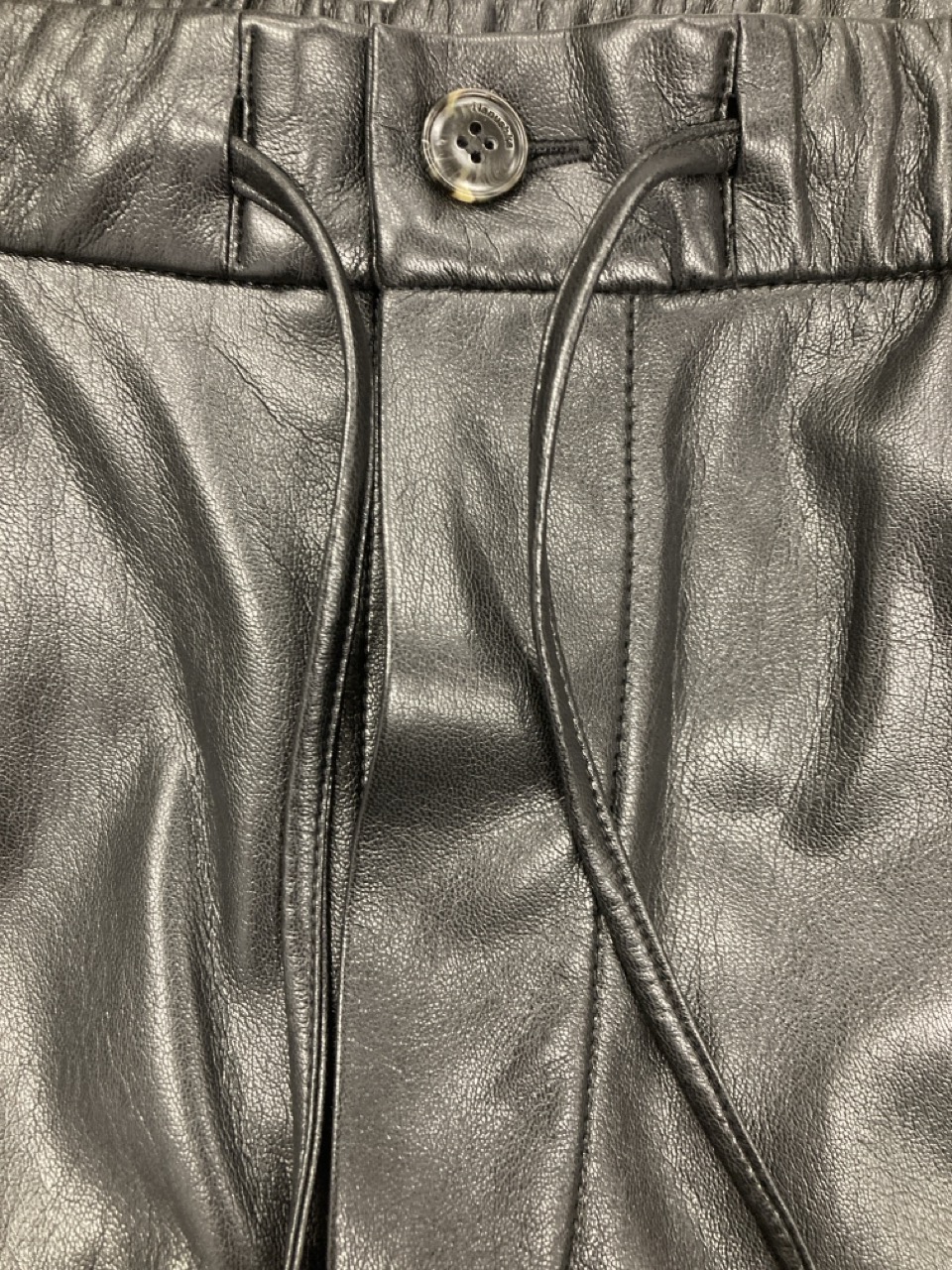 Lot 207  
            Edinburgh SR20 - Delivery Only 

                
NANUSKHA DRAWSTRING PANTS IN BLACK FAUX LEATHER SIZE M: LOCATION - RAIL 2