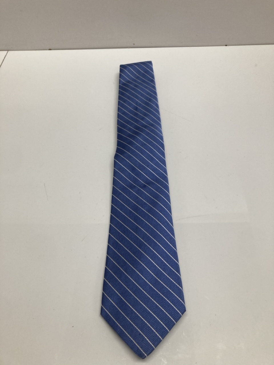 Lot 245  
            Edinburgh SR20 - Delivery Only 

                
RALPH LAUREN STRIPE FORMAL TIE IN BLUE PRINT SILK: LOCATION - TABLE 1