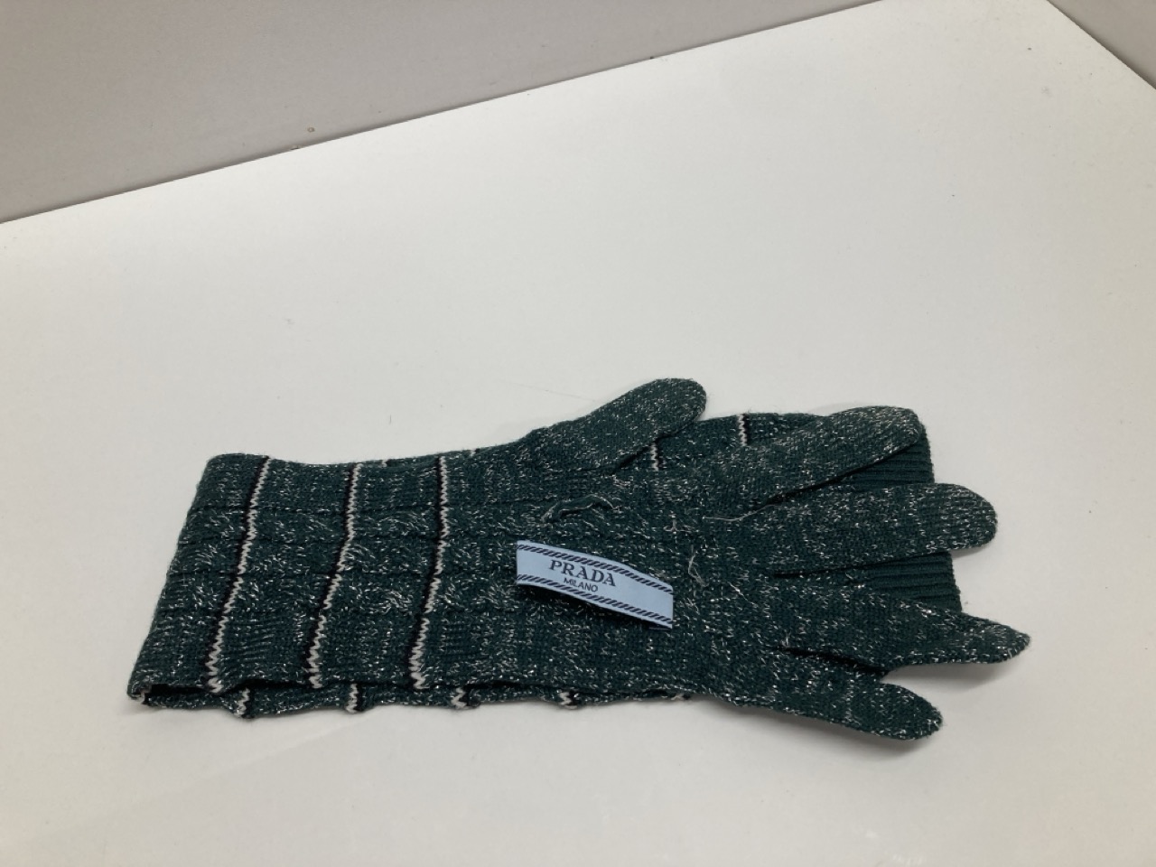 Lot 254  
            Edinburgh SR20 - Delivery Only 

                
PRADA STRIPED LONG KNITTED GLOVES IN GREEN WOOL BLEND : LOCATION - TABLE 1