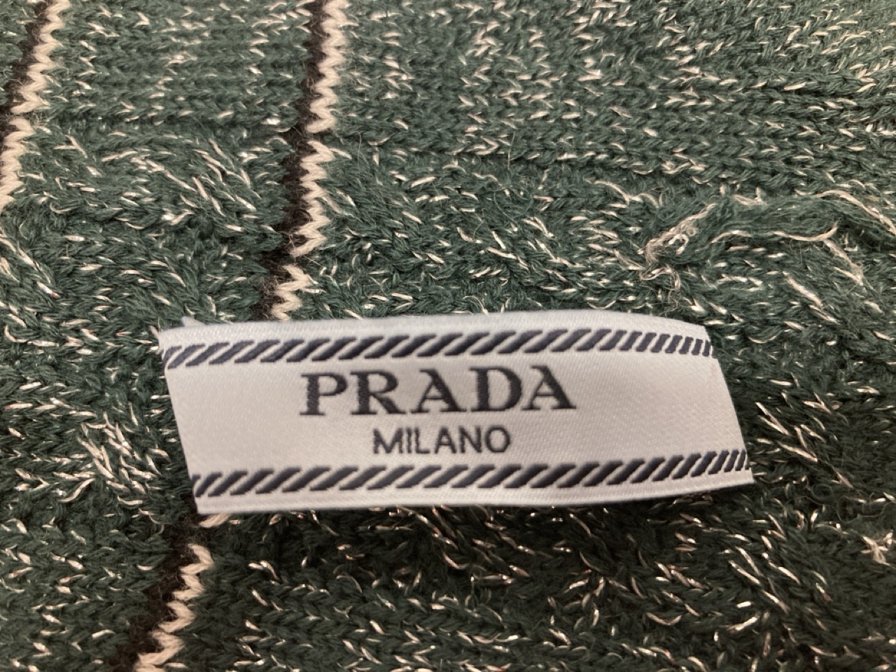 Lot 254  
            Edinburgh SR20 - Delivery Only 

                
PRADA STRIPED LONG KNITTED GLOVES IN GREEN WOOL BLEND : LOCATION - TABLE 1