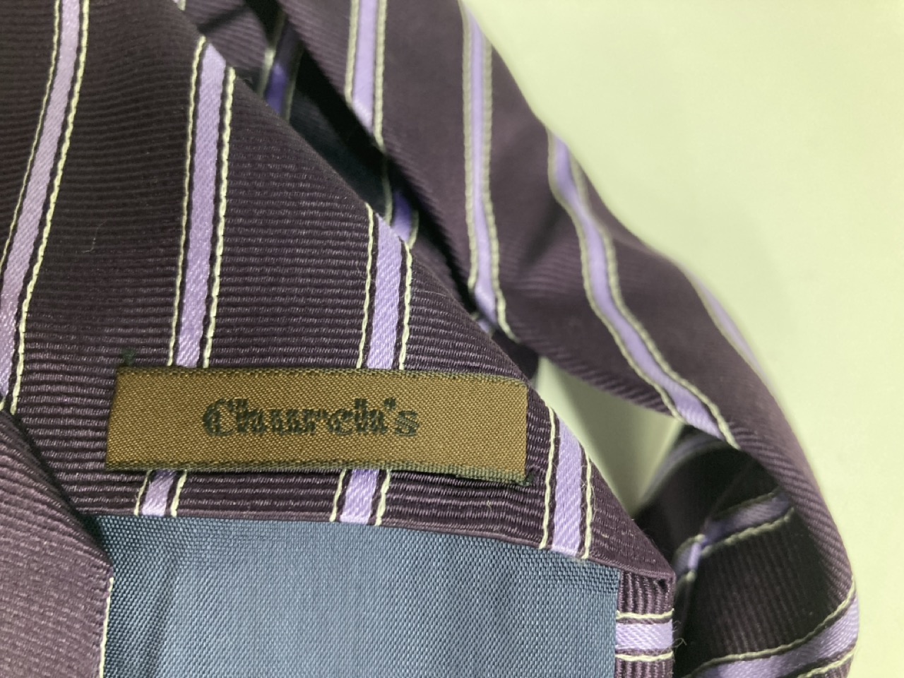 Lot 260  
            Edinburgh SR20 - Delivery Only 

                
CHURCH'S STRIPE FORMAL TIE IN PURPLE PRINT SILK : LOCATION - TABLE 1