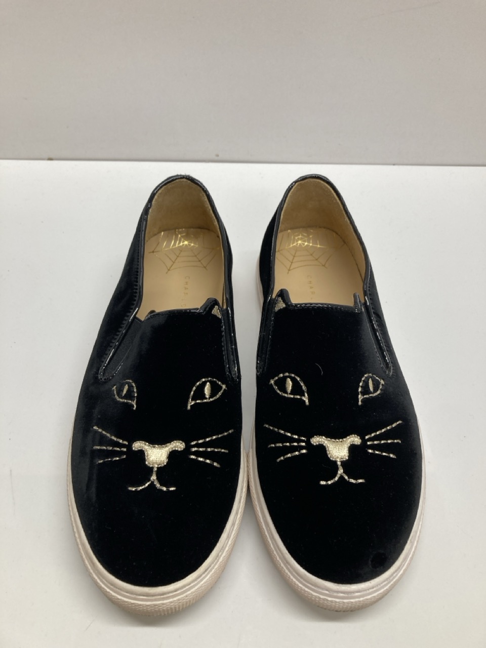 Lot 271  
            Edinburgh SR20 - Delivery Only 

                
CHARLOTTE OLYMPIA EMBROIDERED ACCENT SNEAKERS IN BLACK VELVET SIZE UK 4: LOCATION...