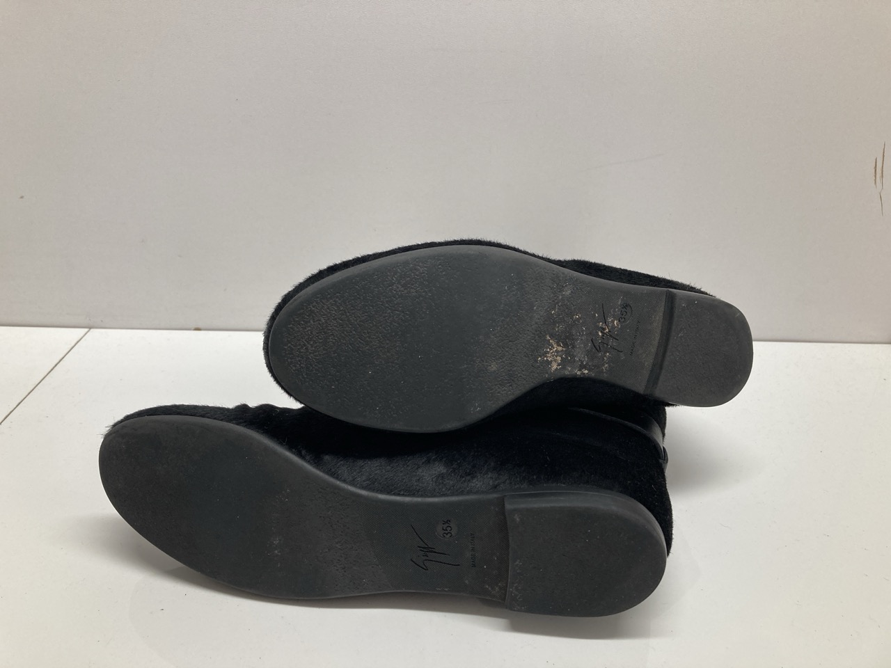 Lot 275  
            Edinburgh SR20 - Delivery Only 

                
GIUSEPPE ZANOTTI BUCKLED ANKLE BOOTS IN BLACK PONY-STYLE LEATHER SIZE 35.5: LOCAT...