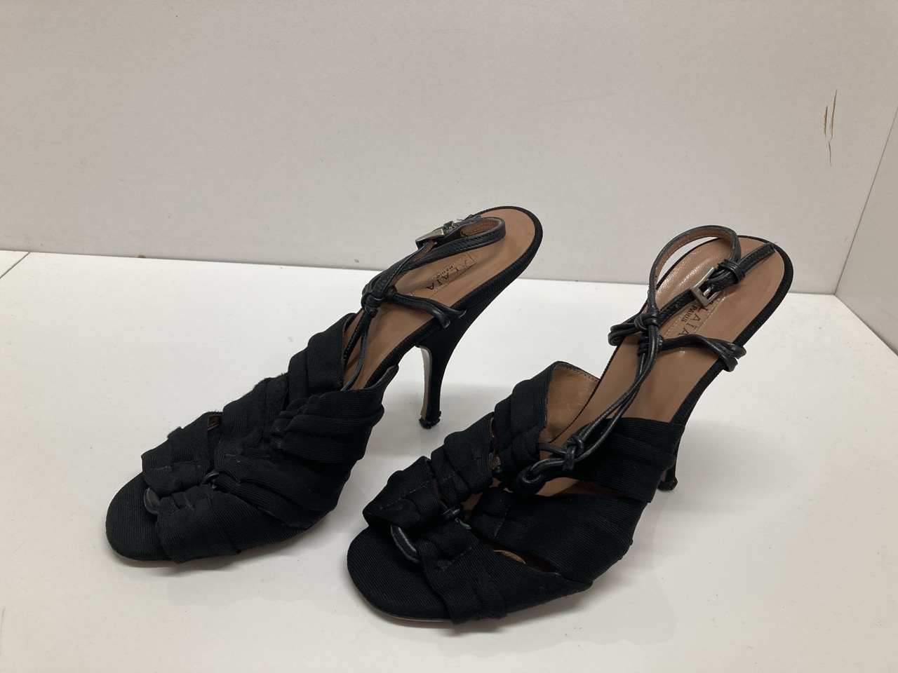 Lot 281  
            Edinburgh SR20 - Delivery Only 

                
ALAIA SLINGBACK HIGH HEEL SANDALS IN BLACK COTTON SIZE UK 3.5: LOCATION - TABLE 2