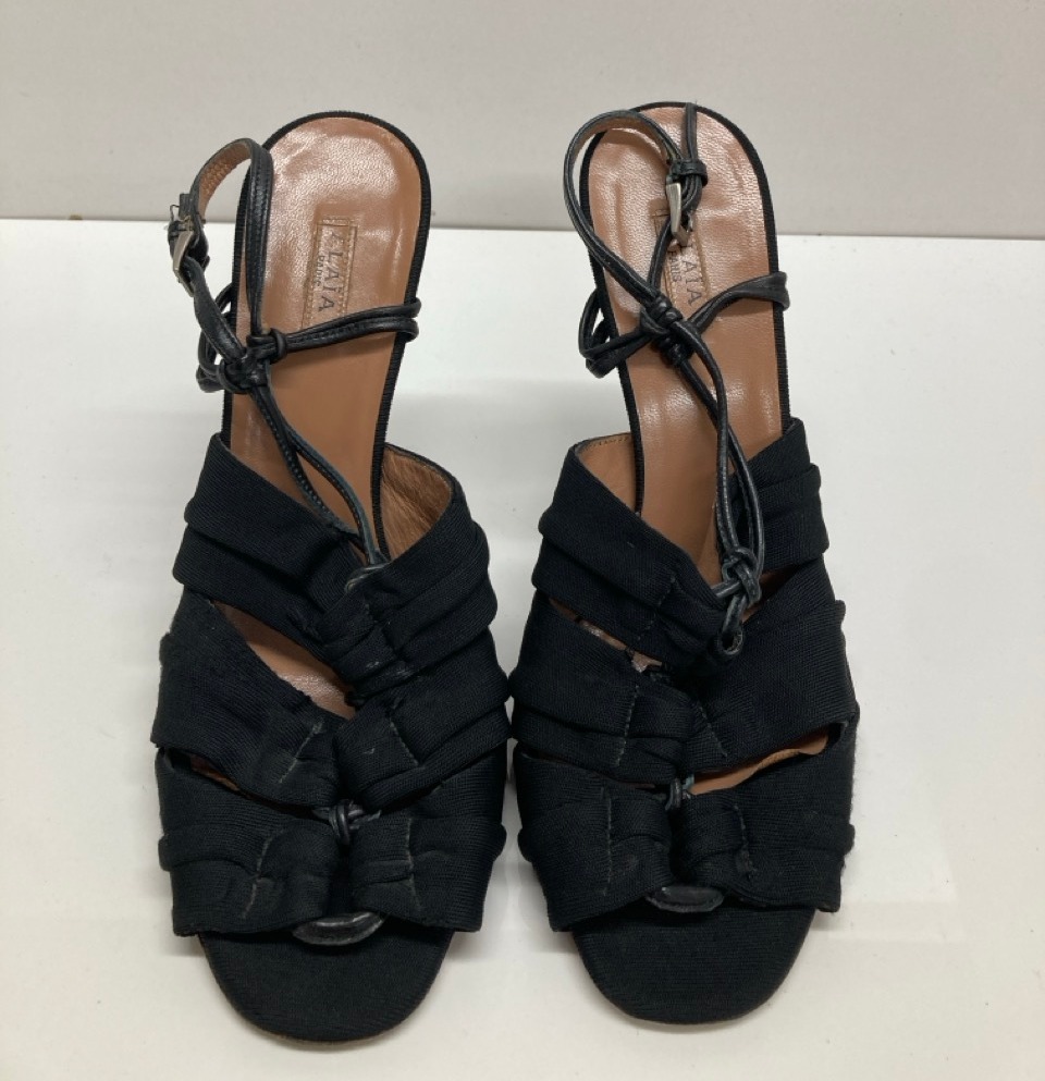 Lot 281  
            Edinburgh SR20 - Delivery Only 

                
ALAIA SLINGBACK HIGH HEEL SANDALS IN BLACK COTTON SIZE UK 3.5: LOCATION - TABLE 2