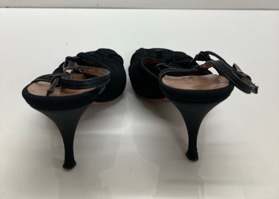 Lot 281  
            Edinburgh SR20 - Delivery Only 

                
ALAIA SLINGBACK HIGH HEEL SANDALS IN BLACK COTTON SIZE UK 3.5: LOCATION - TABLE 2