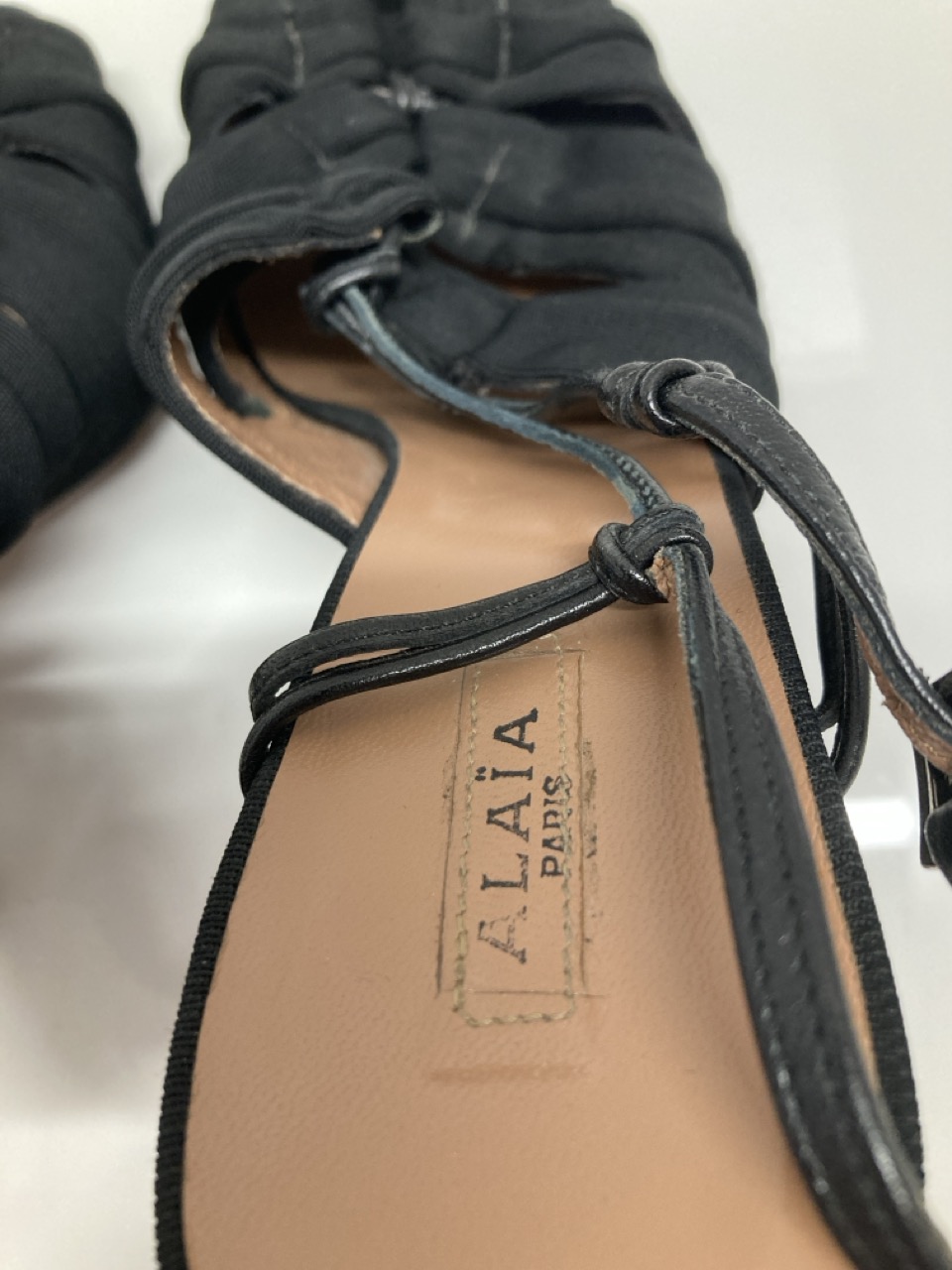 Lot 281  
            Edinburgh SR20 - Delivery Only 

                
ALAIA SLINGBACK HIGH HEEL SANDALS IN BLACK COTTON SIZE UK 3.5: LOCATION - TABLE 2