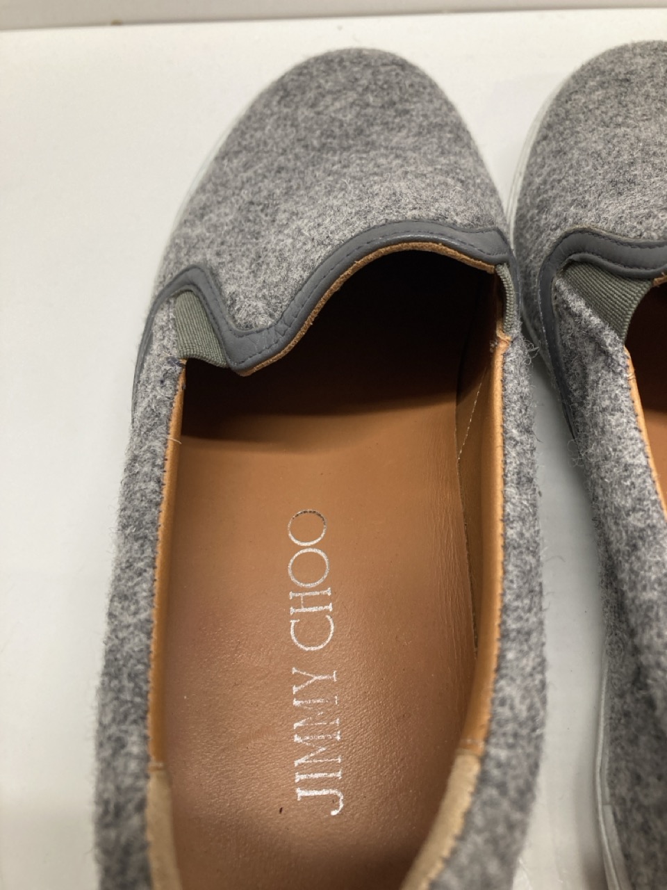 Lot 284  
            Edinburgh SR20 - Delivery Only 

                
JIMMY CHOO SLIP-ON LOAFERS IN GREY WOOL SIZE UK 5: LOCATION - TABLE 2