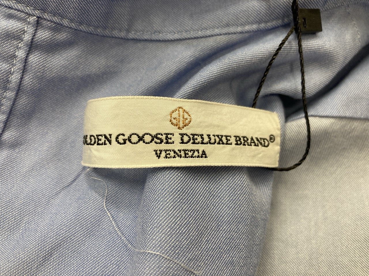 Lot 305  
            Edinburgh SR20 - Delivery Only 

                
GOLDEN GOOSE TIE-NECK SHIRT IN BLUE COTTON NO SIZE : LOCATION - RAIL 1