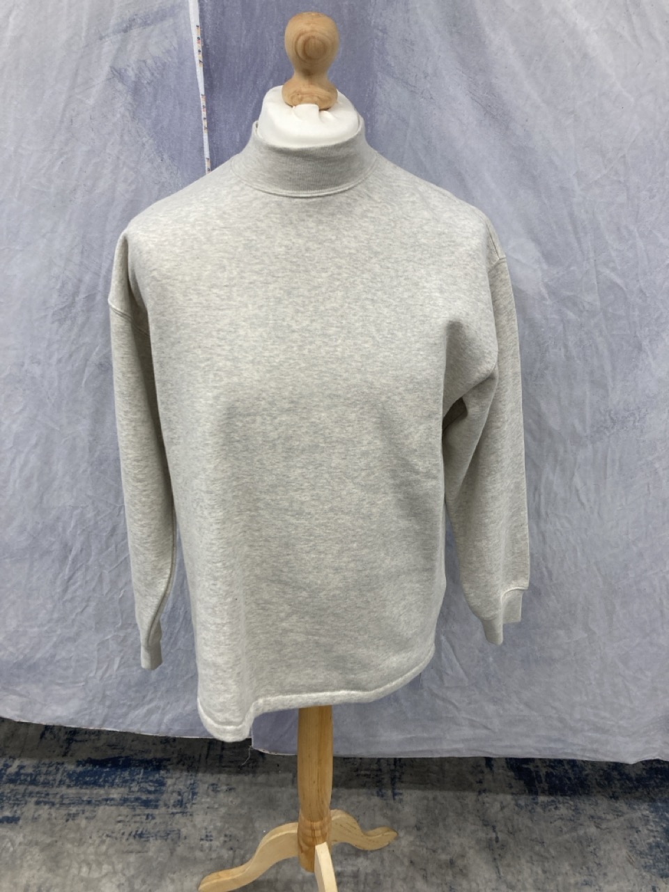 Lot 311  
            Edinburgh SR20 - Delivery Only 

                
FEAR OF GOD ESSENTIALS LOGO-FLOCKED JERSEY MOCK-NECK SWEATSHIRT IN CREAM COTTON S...