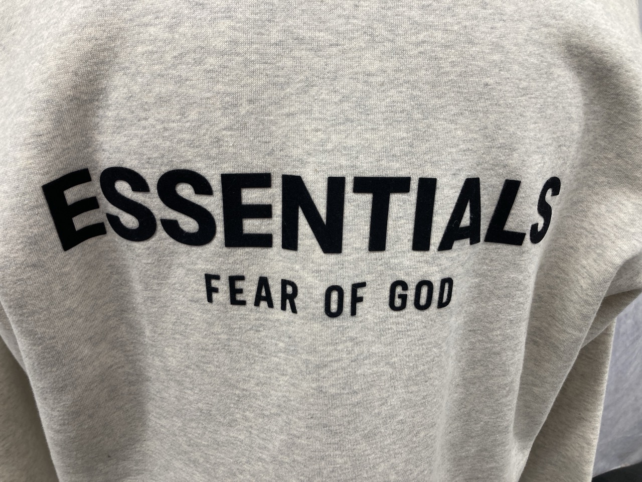 Lot 311  
            Edinburgh SR20 - Delivery Only 

                
FEAR OF GOD ESSENTIALS LOGO-FLOCKED JERSEY MOCK-NECK SWEATSHIRT IN CREAM COTTON S...