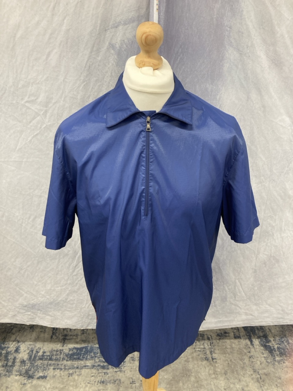 Lot 329  
            Edinburgh SR20 - Delivery Only 

                
PRADA SPORT SHORT SLEEVE OVERSHIRT IN BLUE NYLON NO SIZE : LOCATION - RAIL 1