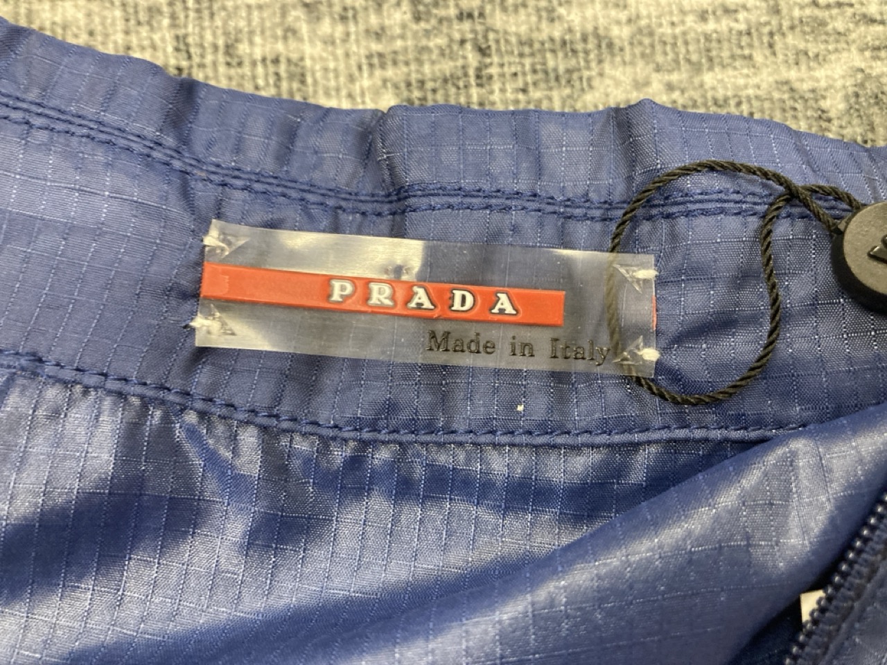 Lot 329  
            Edinburgh SR20 - Delivery Only 

                
PRADA SPORT SHORT SLEEVE OVERSHIRT IN BLUE NYLON NO SIZE : LOCATION - RAIL 1