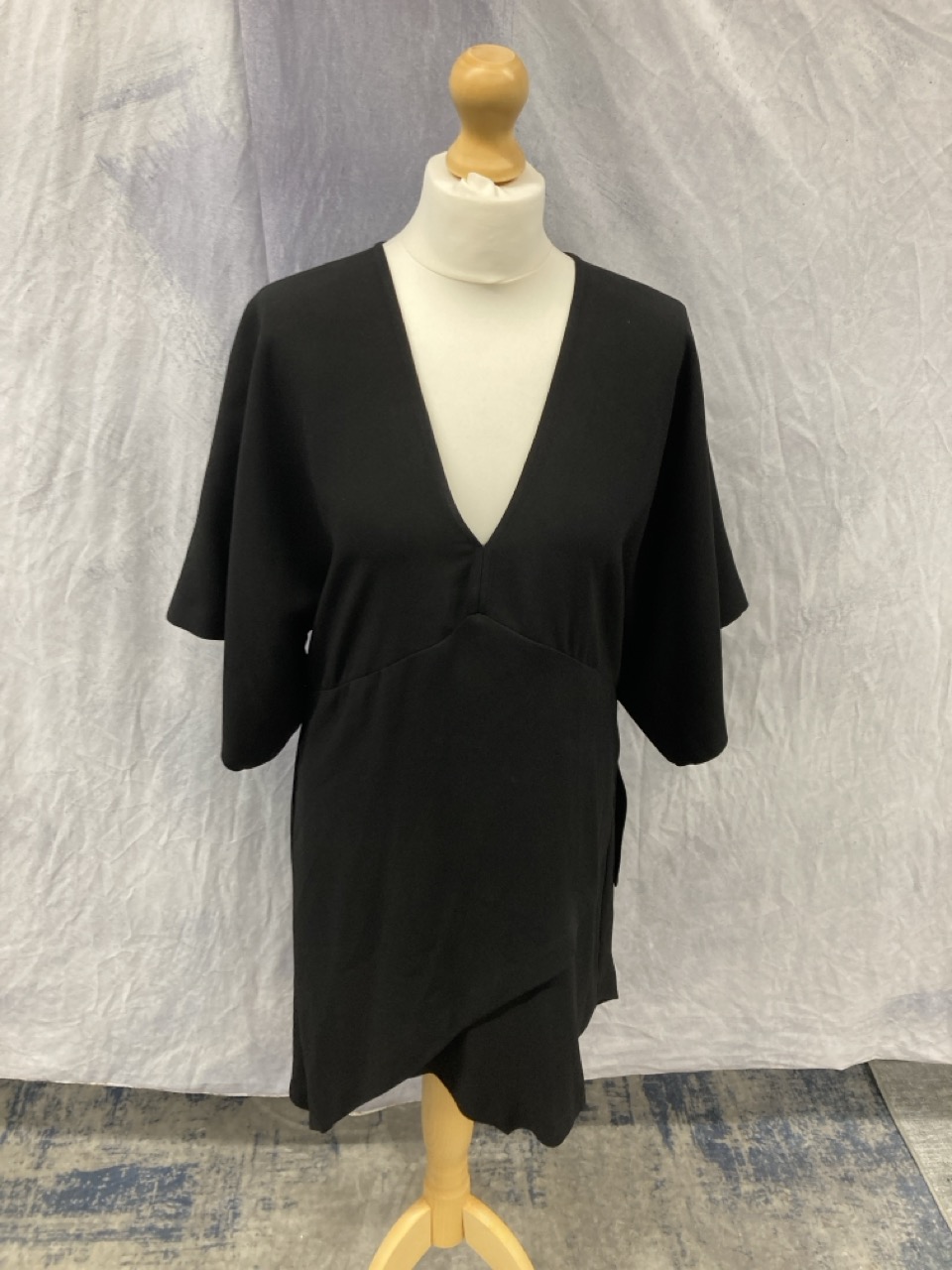 Lot 34  
            Edinburgh SR20 - Delivery Only 

                
IRO V-NECK ASYMMETRICAL DRESS IN BLACK ACETATE SIZE 38: LOCATION - RAIL 3