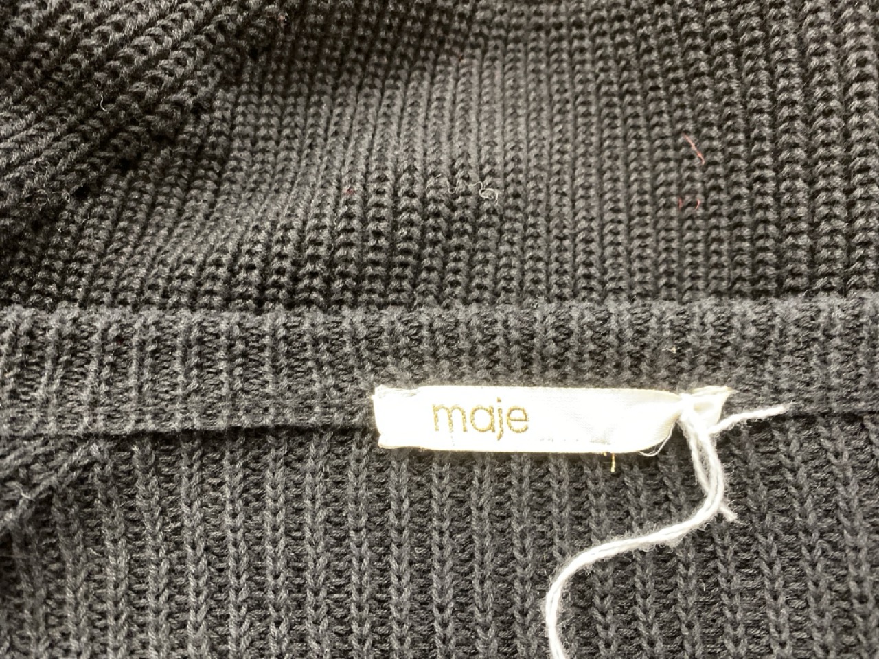 Lot 69  
            Edinburgh SR20 - Delivery Only 

                
MAJE RUFFLED HEM SWEATER IN BLACK COTTON LINEN NO SIZE : LOCATION - RAIL 3