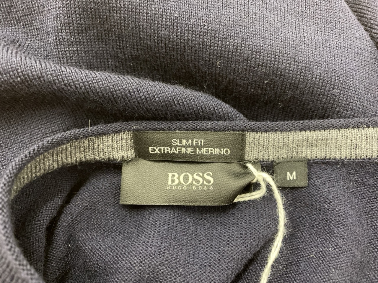 Lot 70  
            Edinburgh SR20 - Delivery Only 

                
BOSS SLIM FIT V-NECK SWEATER IN NAVY BLUE MERINO WOOL SIZE M: LOCATION - RAIL 3