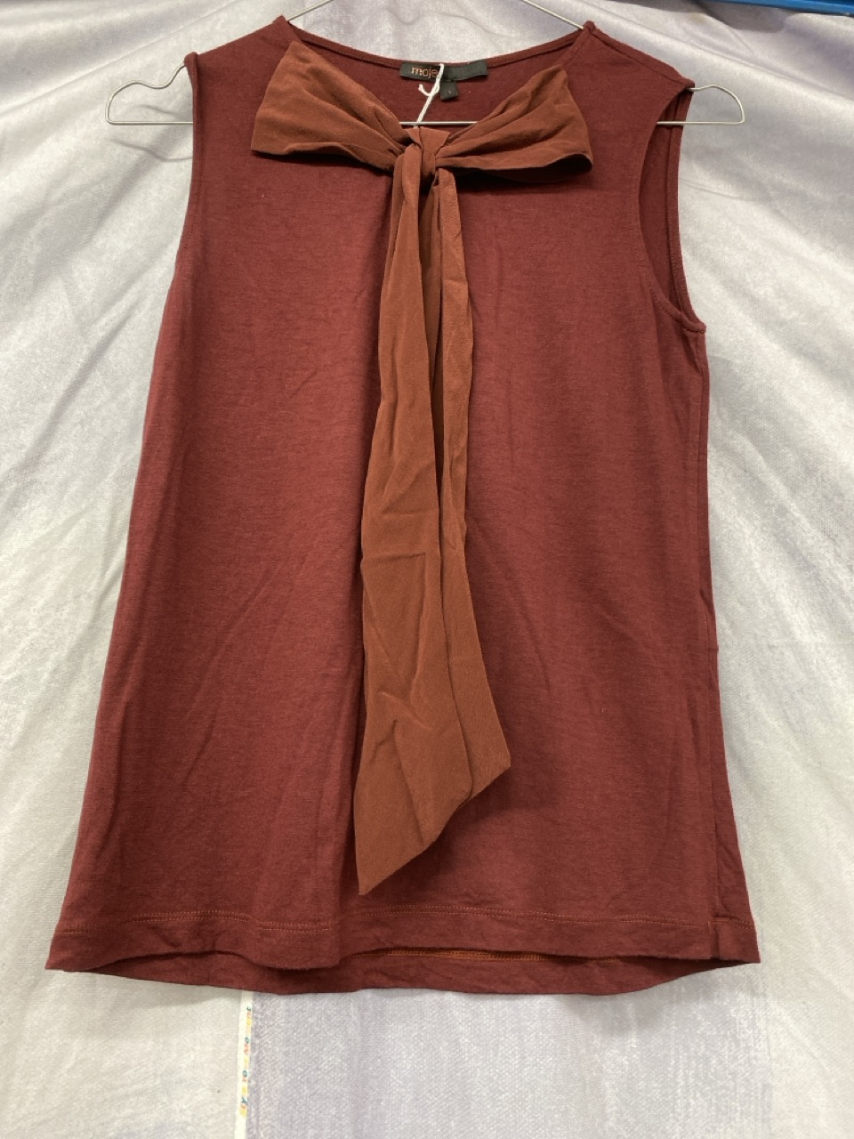 Lot 80  
            Edinburgh SR20 - Delivery Only 

                
MAJE BOW FRONT SLEEVELESS TOP IN RED VISCOSE SIZE 1: LOCATION - RAIL 3