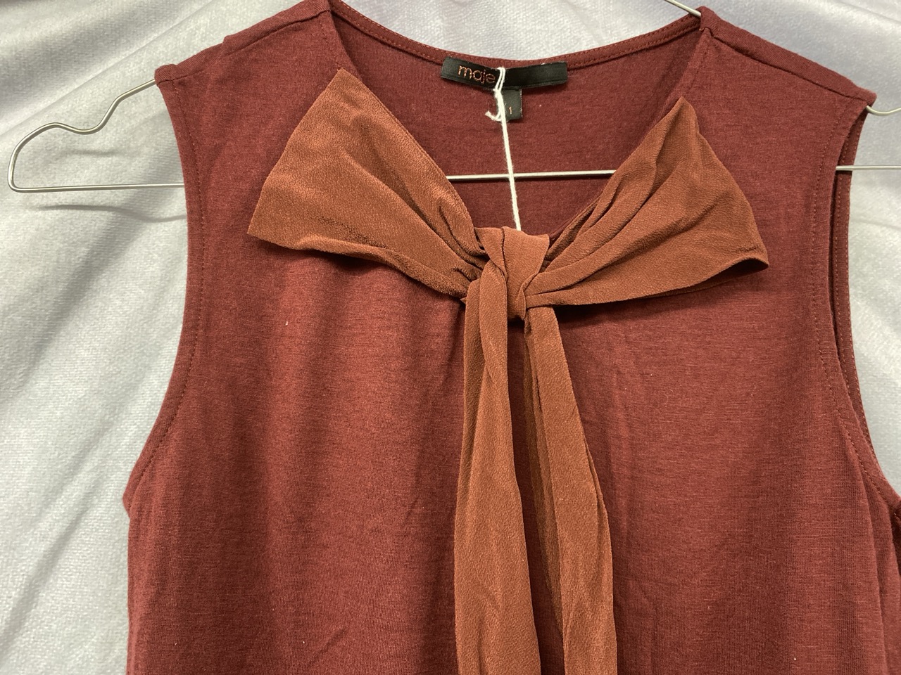 Lot 80  
            Edinburgh SR20 - Delivery Only 

                
MAJE BOW FRONT SLEEVELESS TOP IN RED VISCOSE SIZE 1: LOCATION - RAIL 3