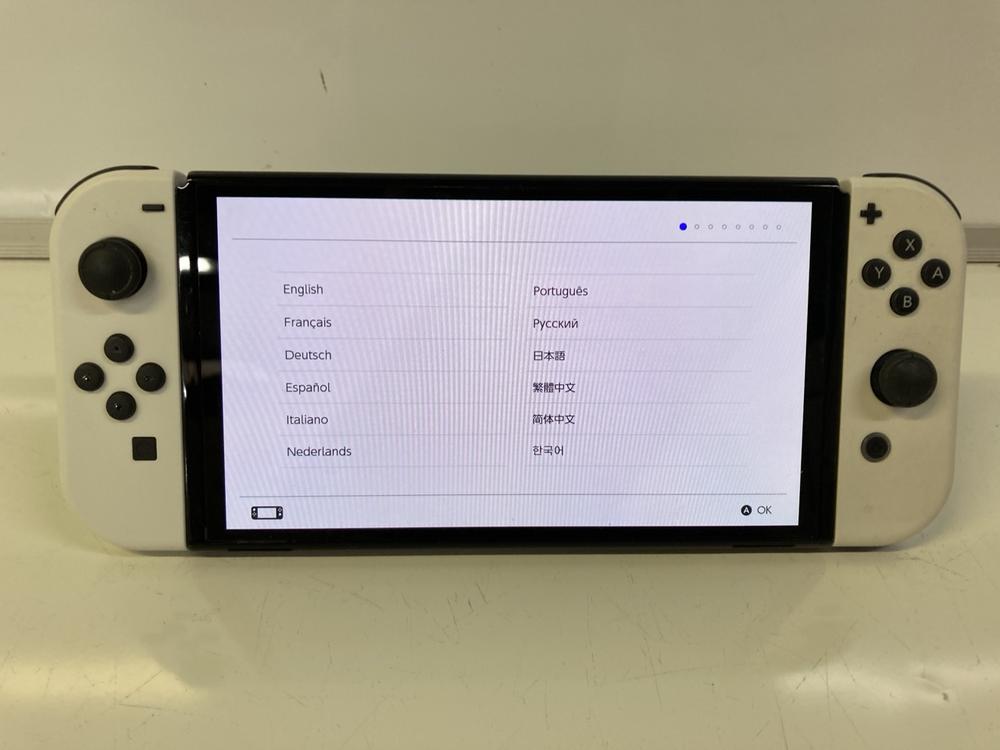 Lot 20  
            Birmingham Premium - Parcel Delivery Only 

                
NINTENDO SWITCH | OLED HANDHELD GAMES CONSOLE (ORIGINAL RRP - £299) IN WHITE. (BO...