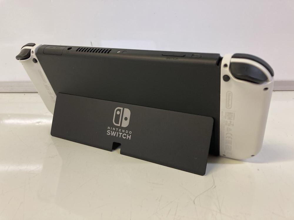 Lot 20  
            Birmingham Premium - Parcel Delivery Only 

                
NINTENDO SWITCH | OLED HANDHELD GAMES CONSOLE (ORIGINAL RRP - £299) IN WHITE. (BO... - Image 2